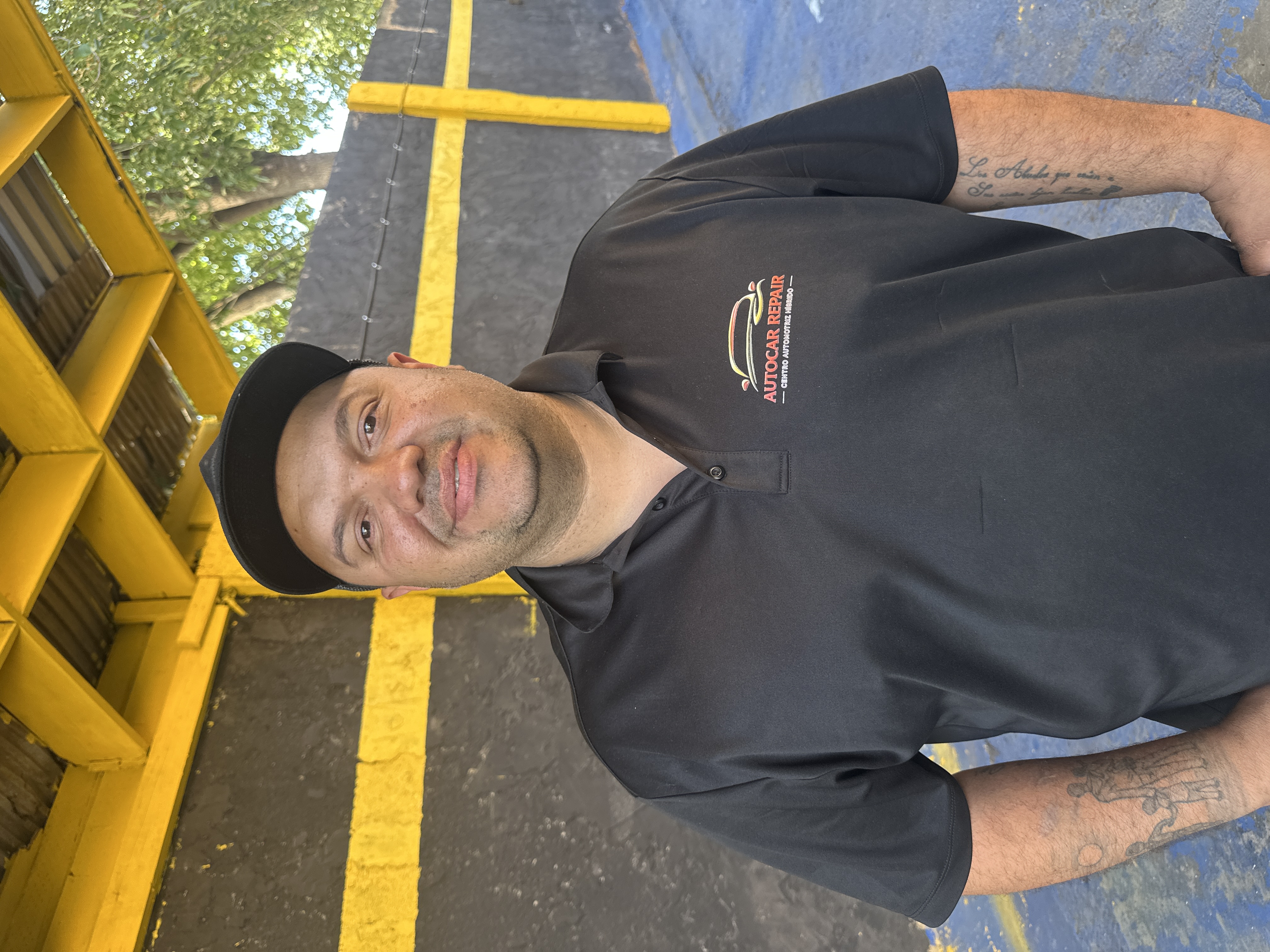 Prime Auto Car team member in a branded uniform